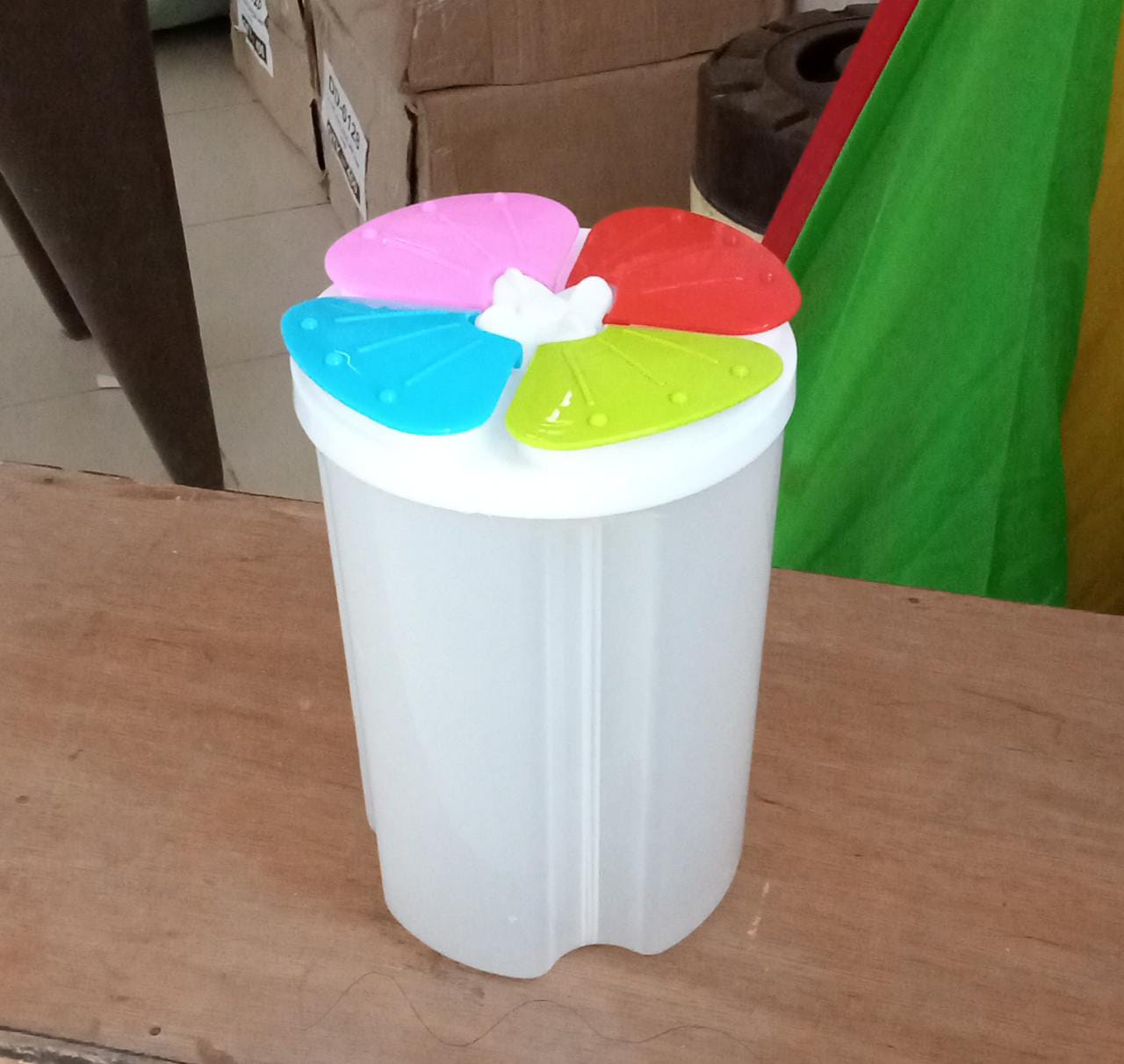 Transparent 4-section storage container for kitchen organization and food storage. Transparent 4-section storage container for kitchen organization and food storage.